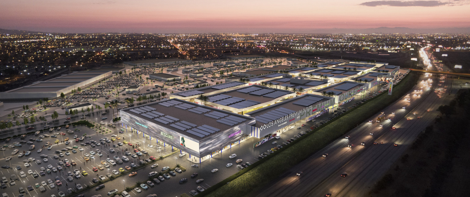 Aerial view of site labeled Los Angeles Premium Outlets. Solar arrays along the tops of buildings that are lifted by columns