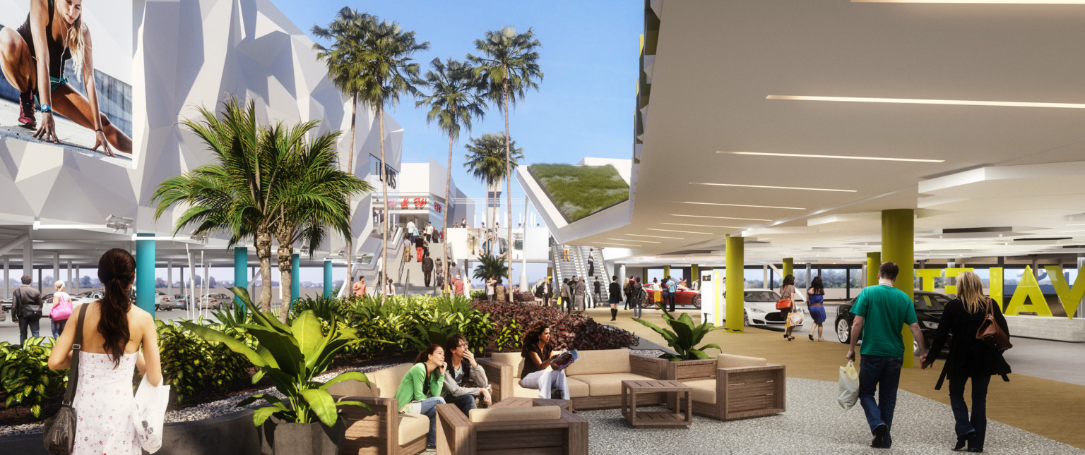 Treelined comfortable seating next to covered valet station, right. White textural building, left, elevated on blue columns