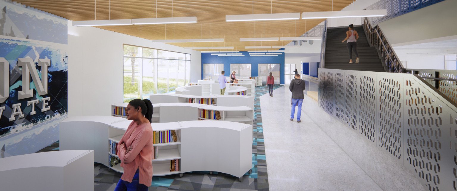 Curved half height white bookshelves to the left with large windows and blue back accent wall. Black stairs and rail right