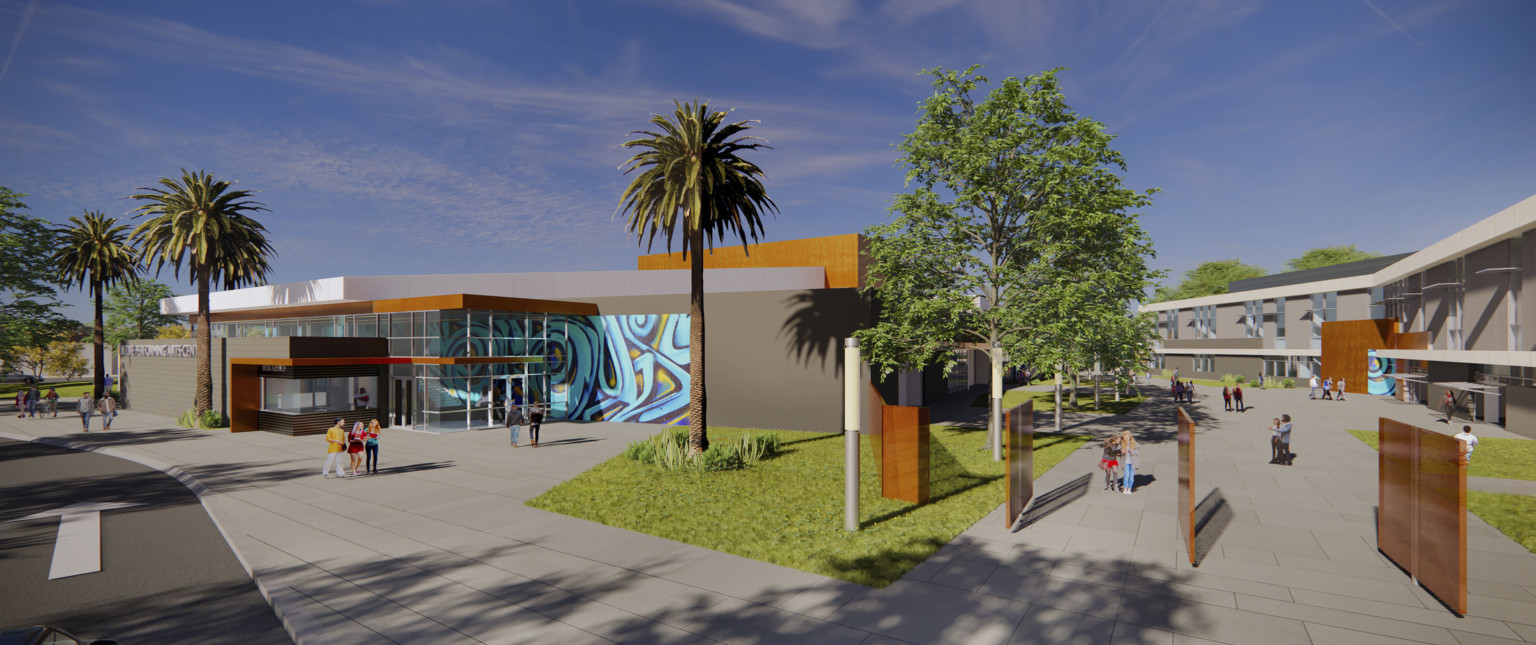 Exterior view of campus with rotating wood gate doors opened. Left, double height glass entry with mural wall detail