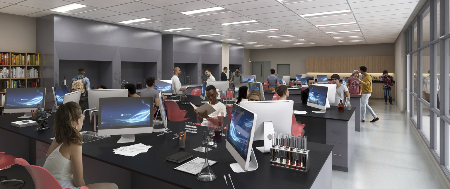 Grey tables with drawers and black counters with computer monitors and science equipment. Recessed counters on left wall