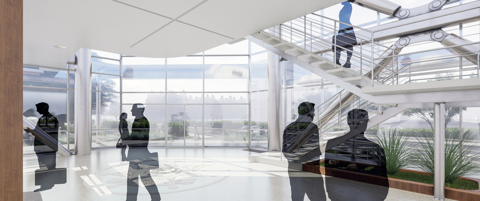 Double height window lobby with floating stairwell, right, over a planter. White panel drop ceiling hangs over logo on floor