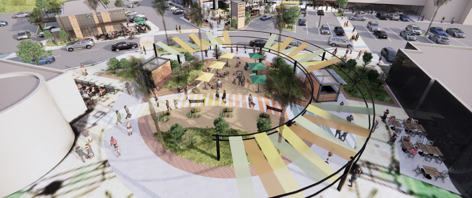 Rounded plaza in shopping center with greenery, partially covered by canopy along edge. Covered wood kiosks to either side