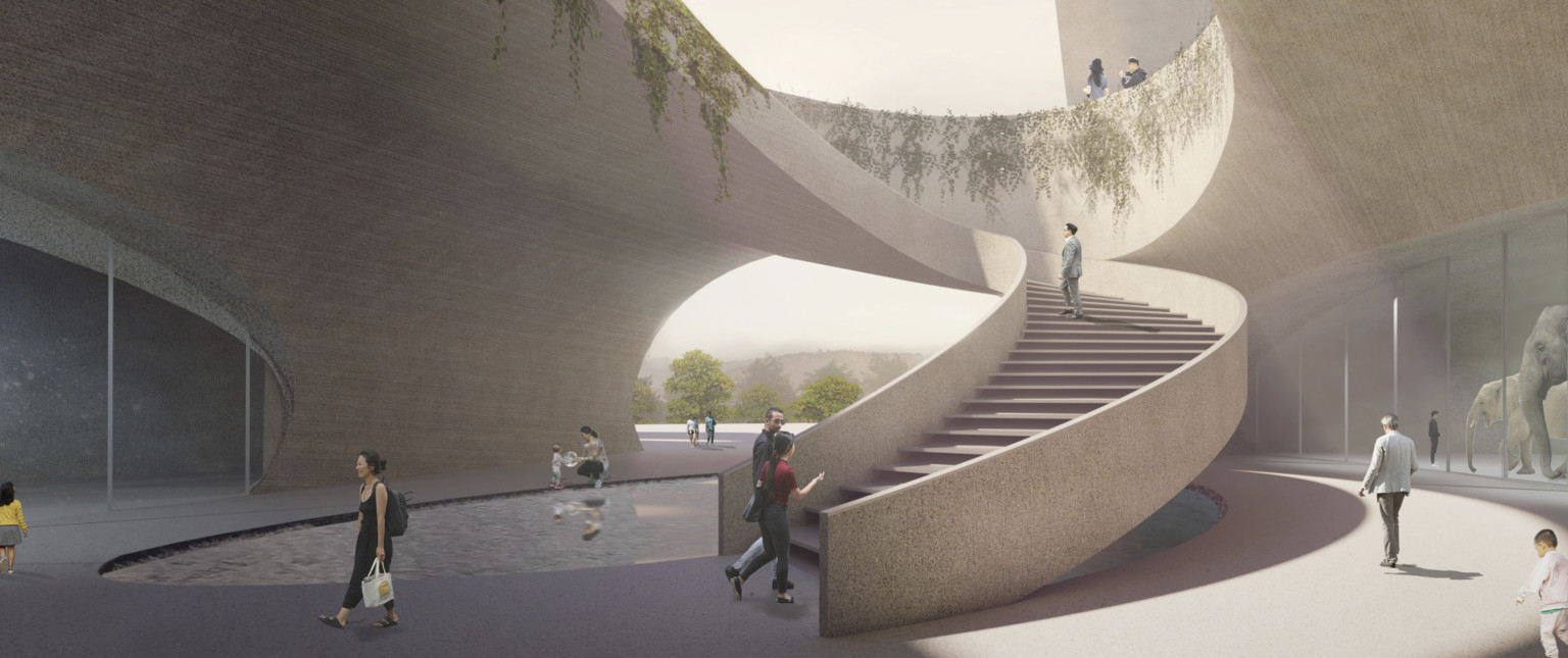 Staircase spirals around pool of water in curved semi exposed courtyard. Windows look into the building on either side.