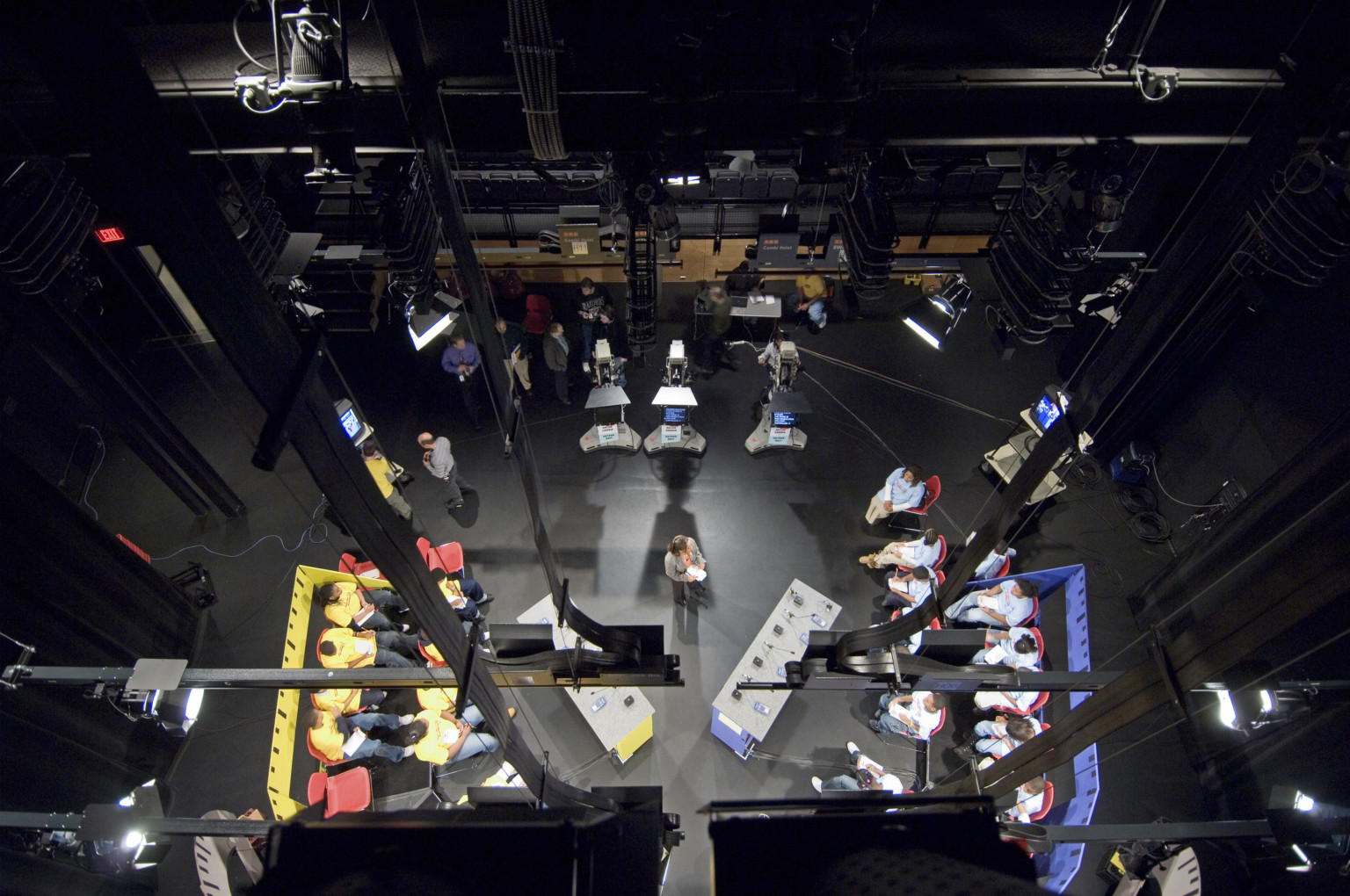 view into a backstage setting through ropes and rigging