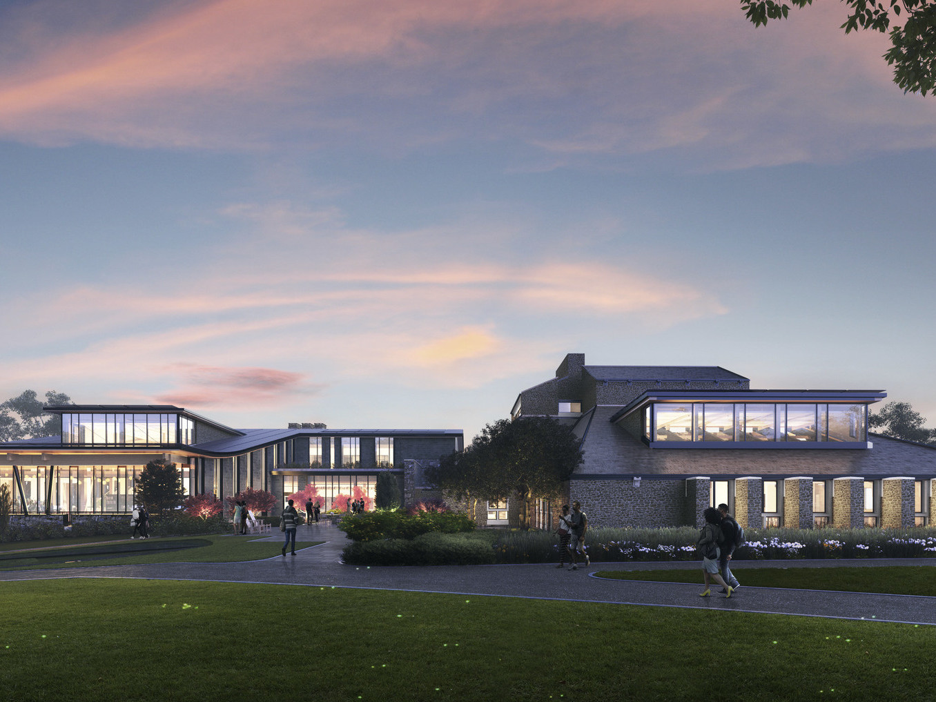 Swarthmore College Dining and Community Commons front entry illuminated from within in the evening