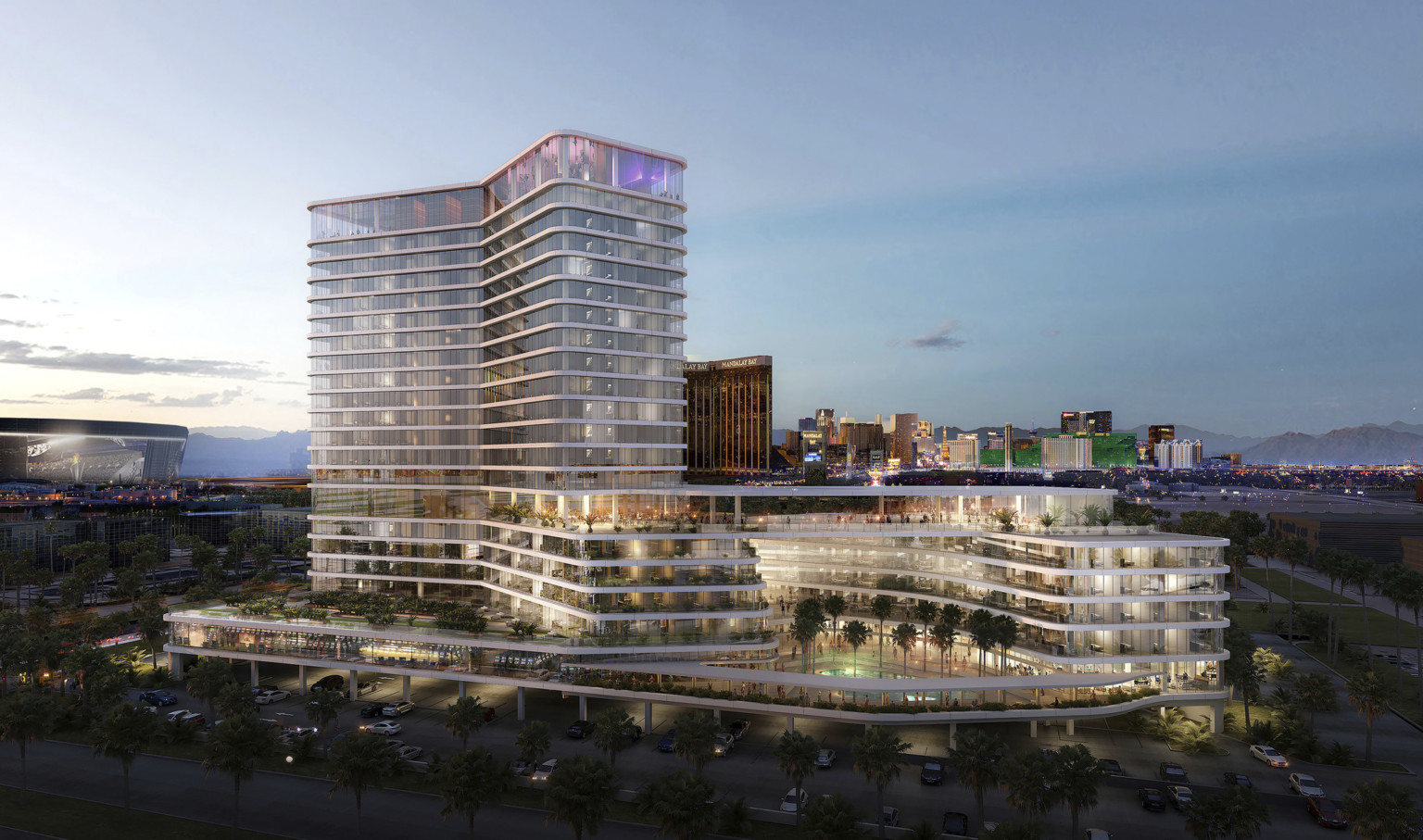 Hotel viewed from corner from above. Stepped balconies extend in two angled directions. Top story illuminated in purple