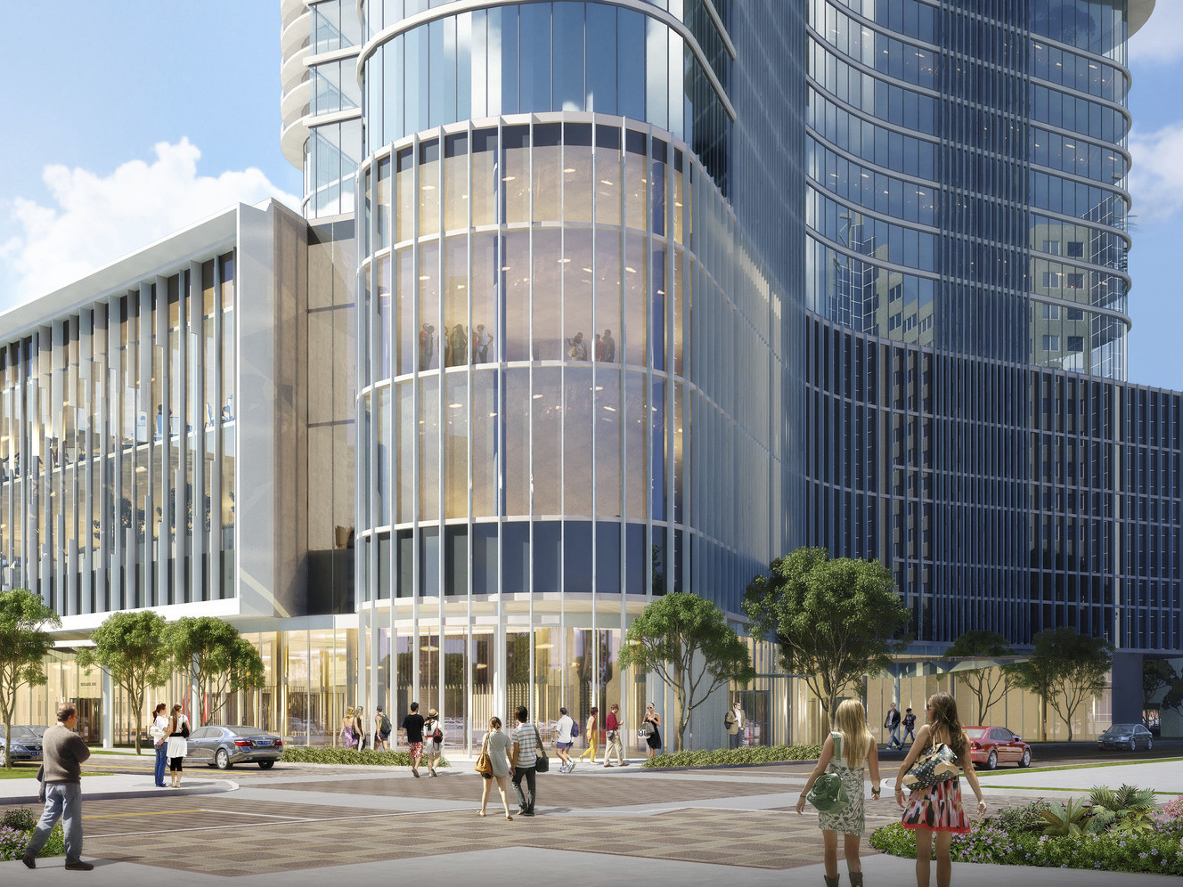 The Summa Orlando Hotel and Mixed Use Tower seen from the front, the glass lined building curved to rounded entry