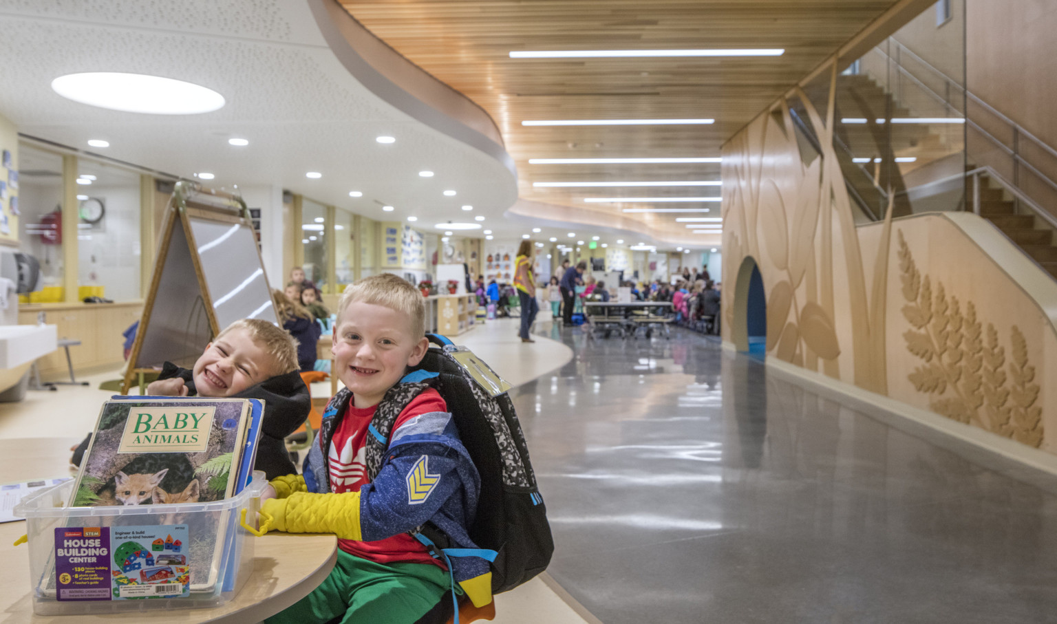 Children playing at wooden table at Pathfinder Kindergarten Center