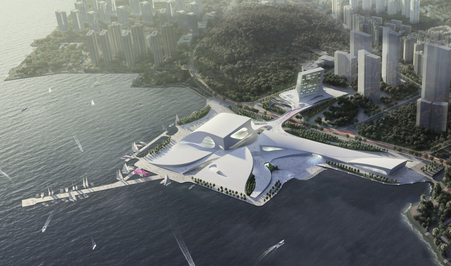 Aerial view of the sloping white Shenzhen Opera house between the Shenzhen Bay and Shekou Mountains