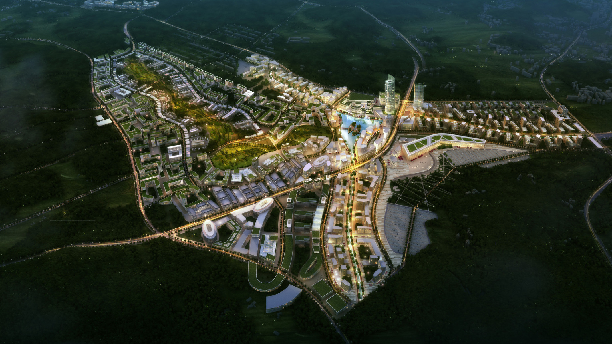 Smart City Korea illuminated at night with green roof buildings and a large park curving towards lake