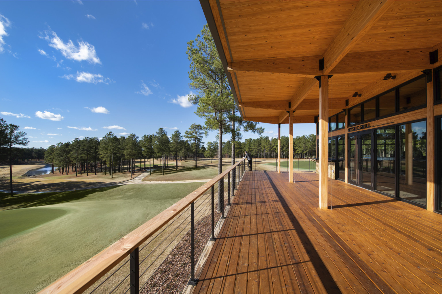 Mystic Creek Clubhouse, 2022 Woodworks Regional Design Excellence Award winner; mass timber balcony and canopy over golf course