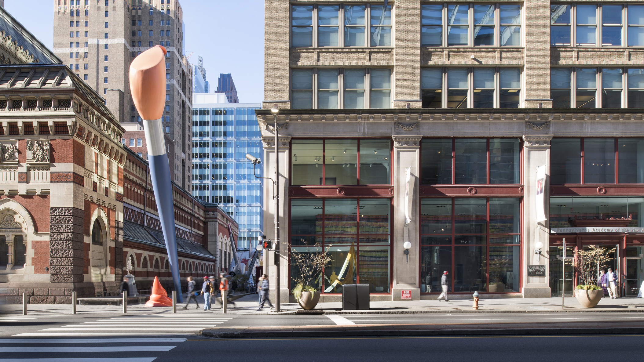 street view of Pennsylvania Academy of the Fine Arts building with two story blue and orange paint brush sculpture outside