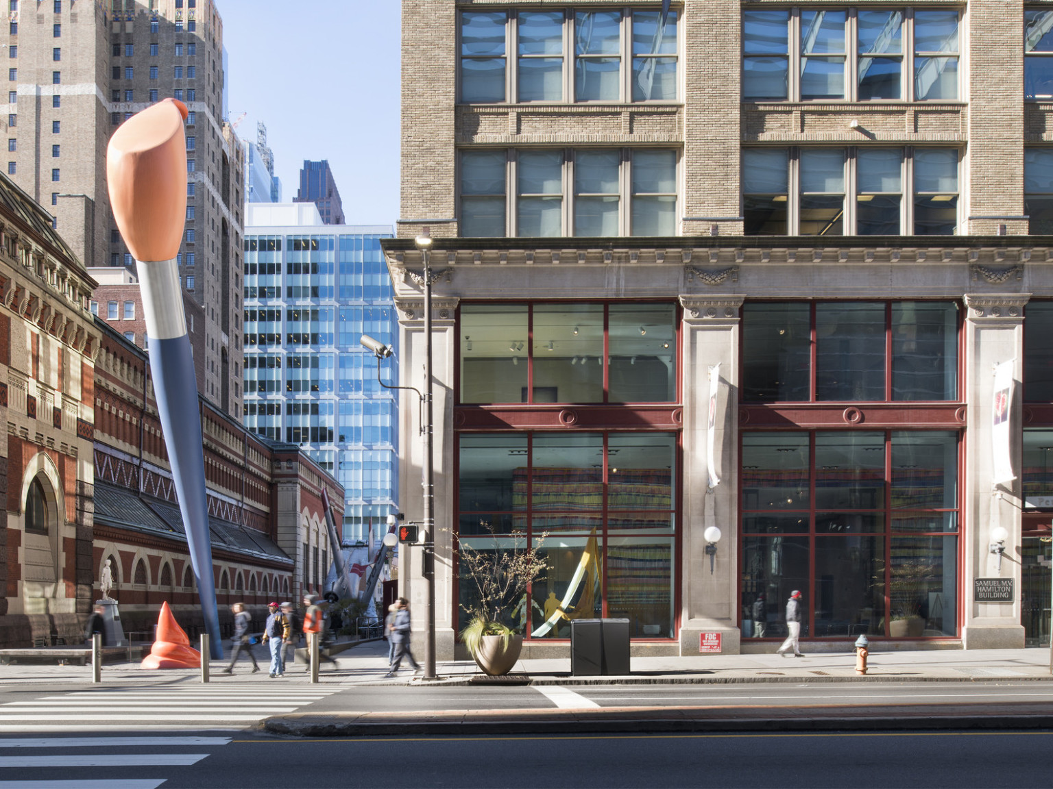 street view of Pennsylvania Academy of the Fine Arts building with two story blue and orange paint brush sculpture outside