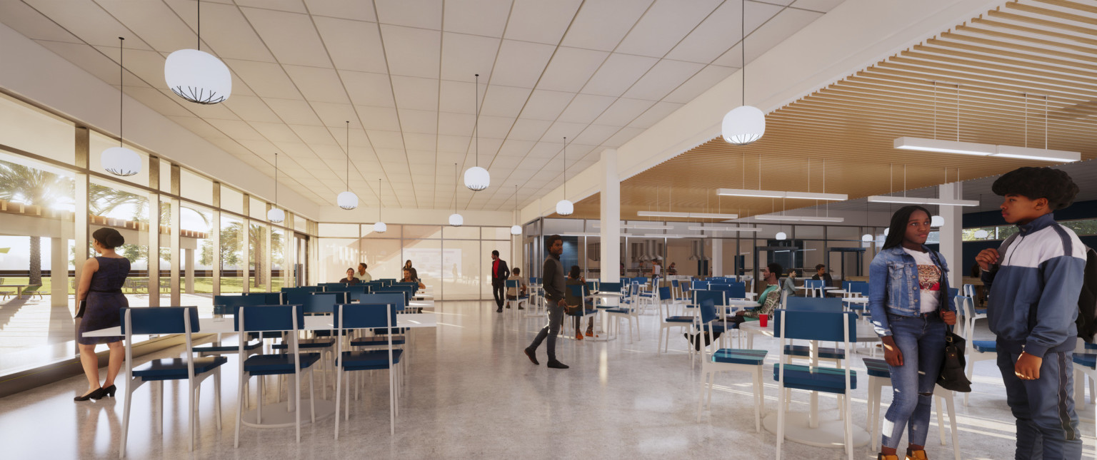 Cafeteria with floor to ceiling windows. White panel ceiling with hanging pendant lights, left, and wood slats to right
