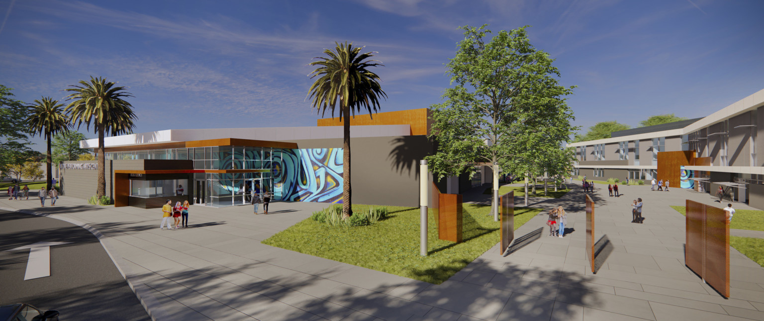 Exterior view of campus with rotating wood gate doors opened. Left, double height glass entry with mural wall detail