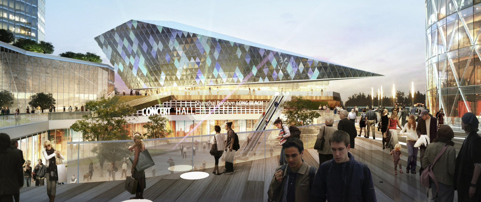 An elevated walkway above a plaza facing the concert hall, an angular, pointed building with iridescent, diamond shaped glass