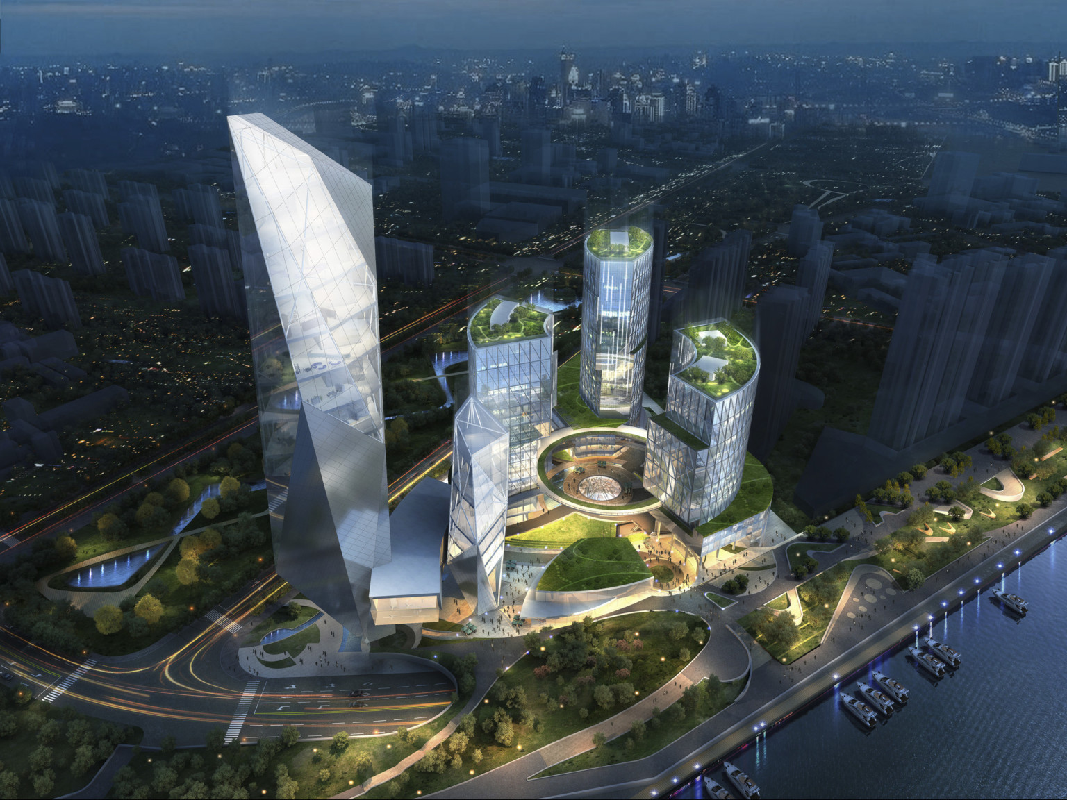 Mixed use campus illuminated at night. 3 buildings with green roofs connected by round elevated walkways. Left, angular tower