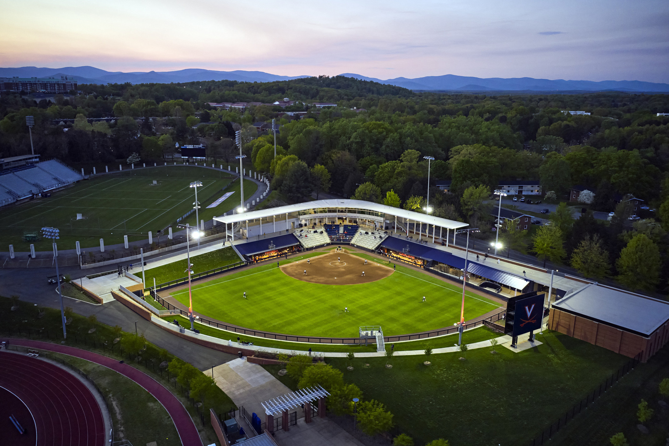 Palmer Park baseball stadium at the University of Virginia aerial view. Blue and white bleachers and mural on dugout visible