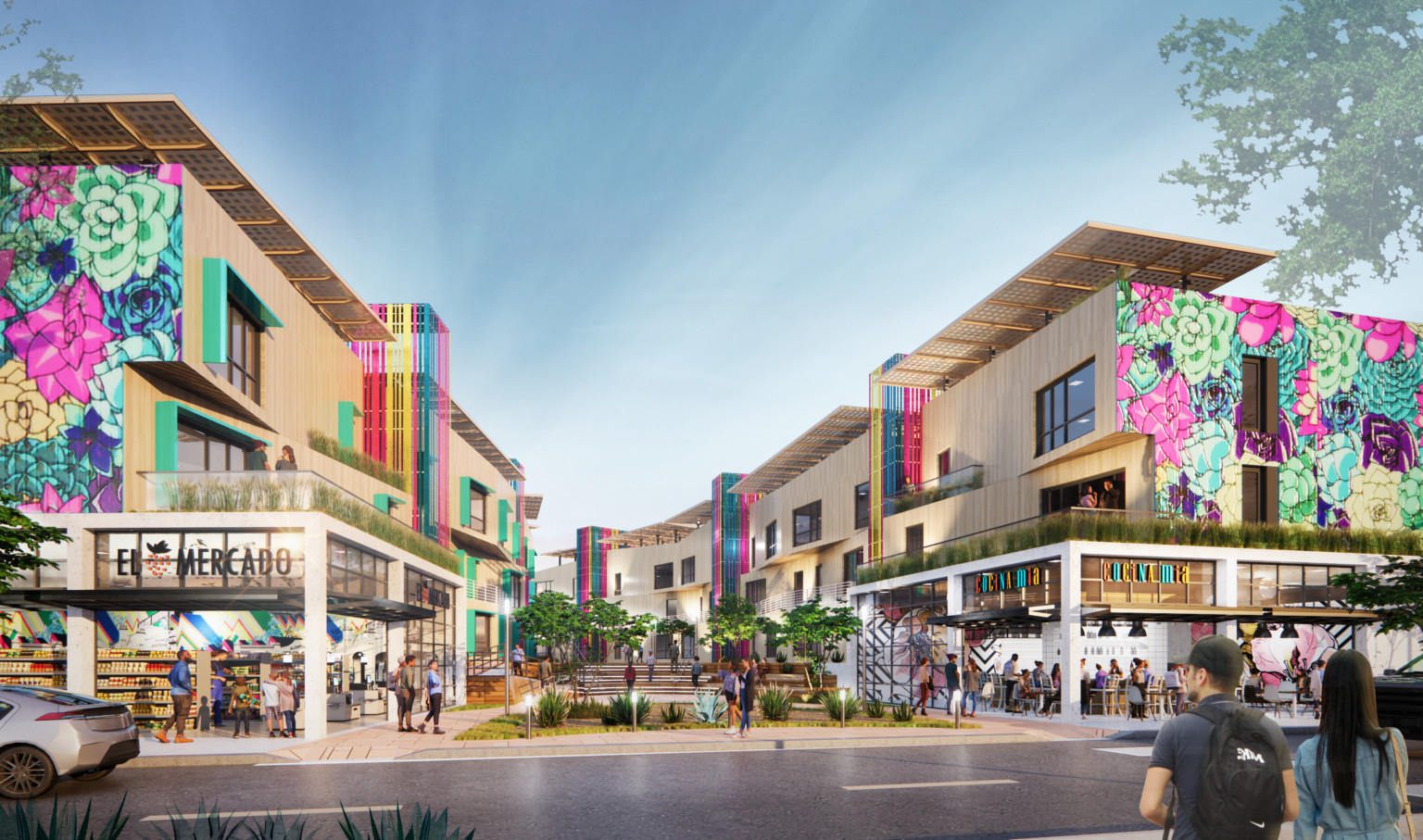 Semillas y Raices mixed use housing development entrance with shops on 1st level, apartments above on either side of walkway