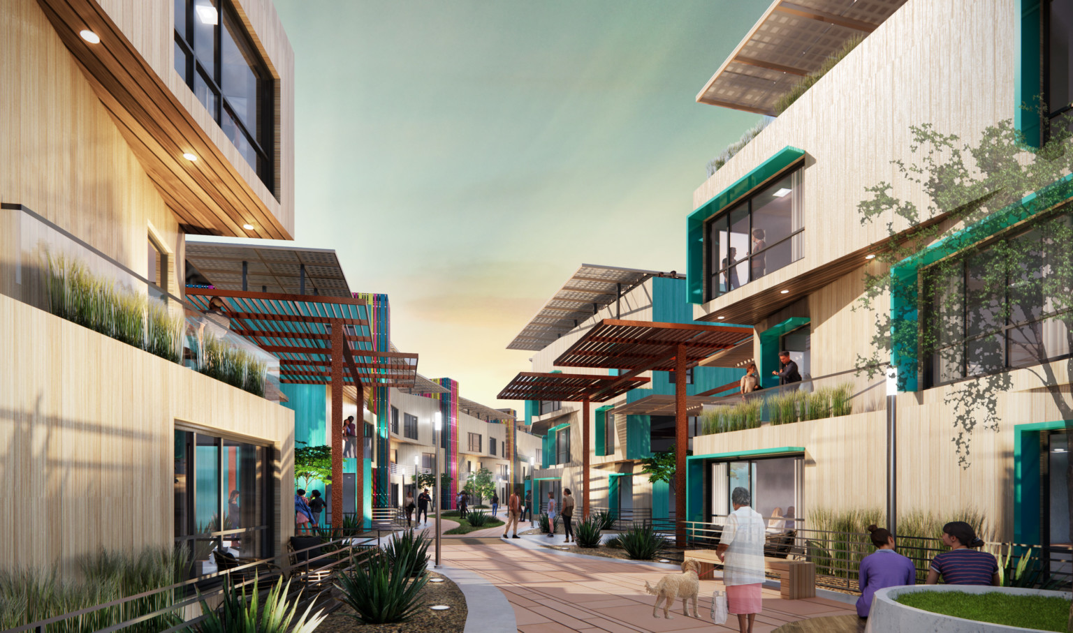 Lines of 3 story buildings face each other across central walkway, framed by covered patios, balconies, and greenery