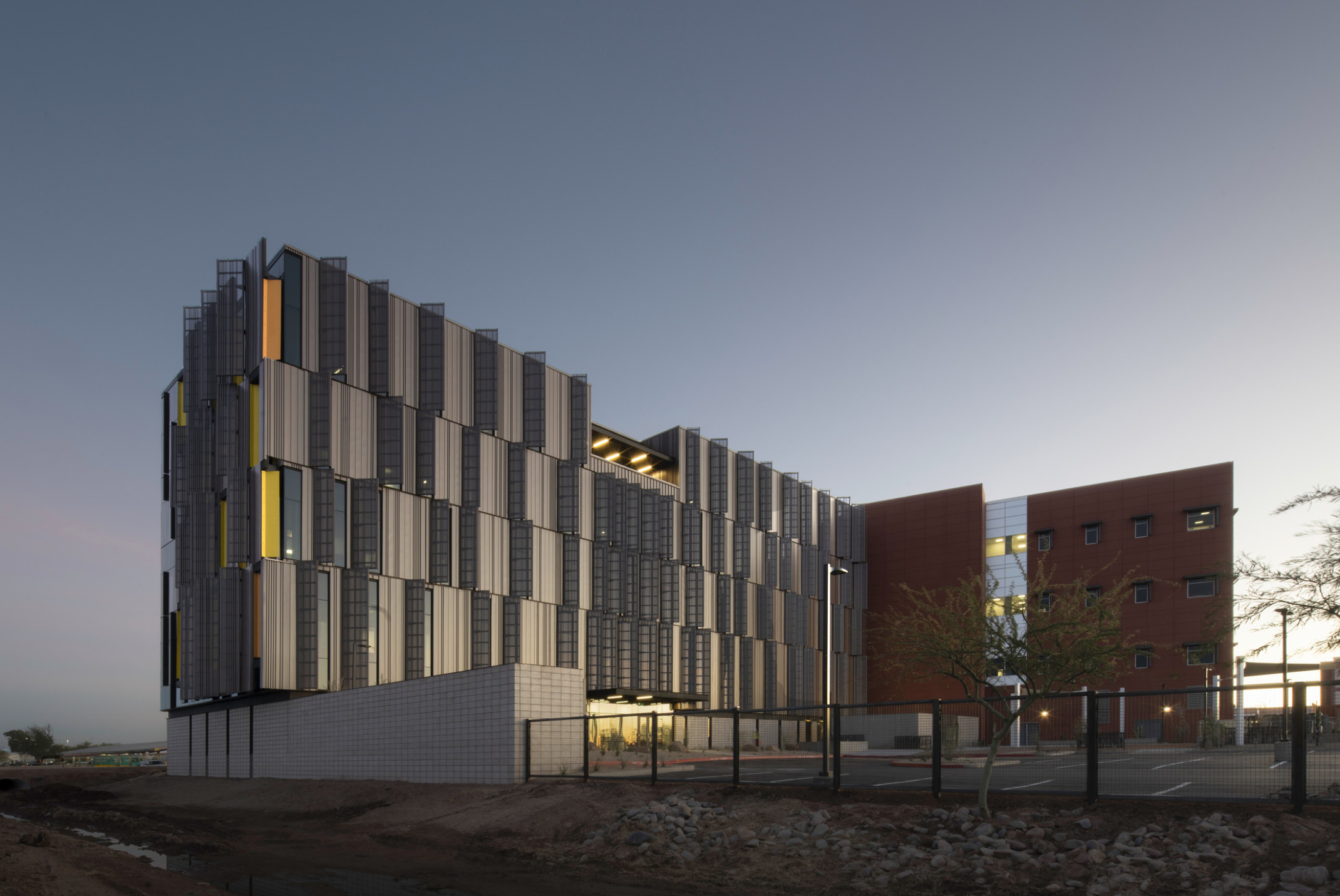 Dusk shot of Pinal County Attorney’s Offices, a serrated wrapped facade in alternating horizontal layers