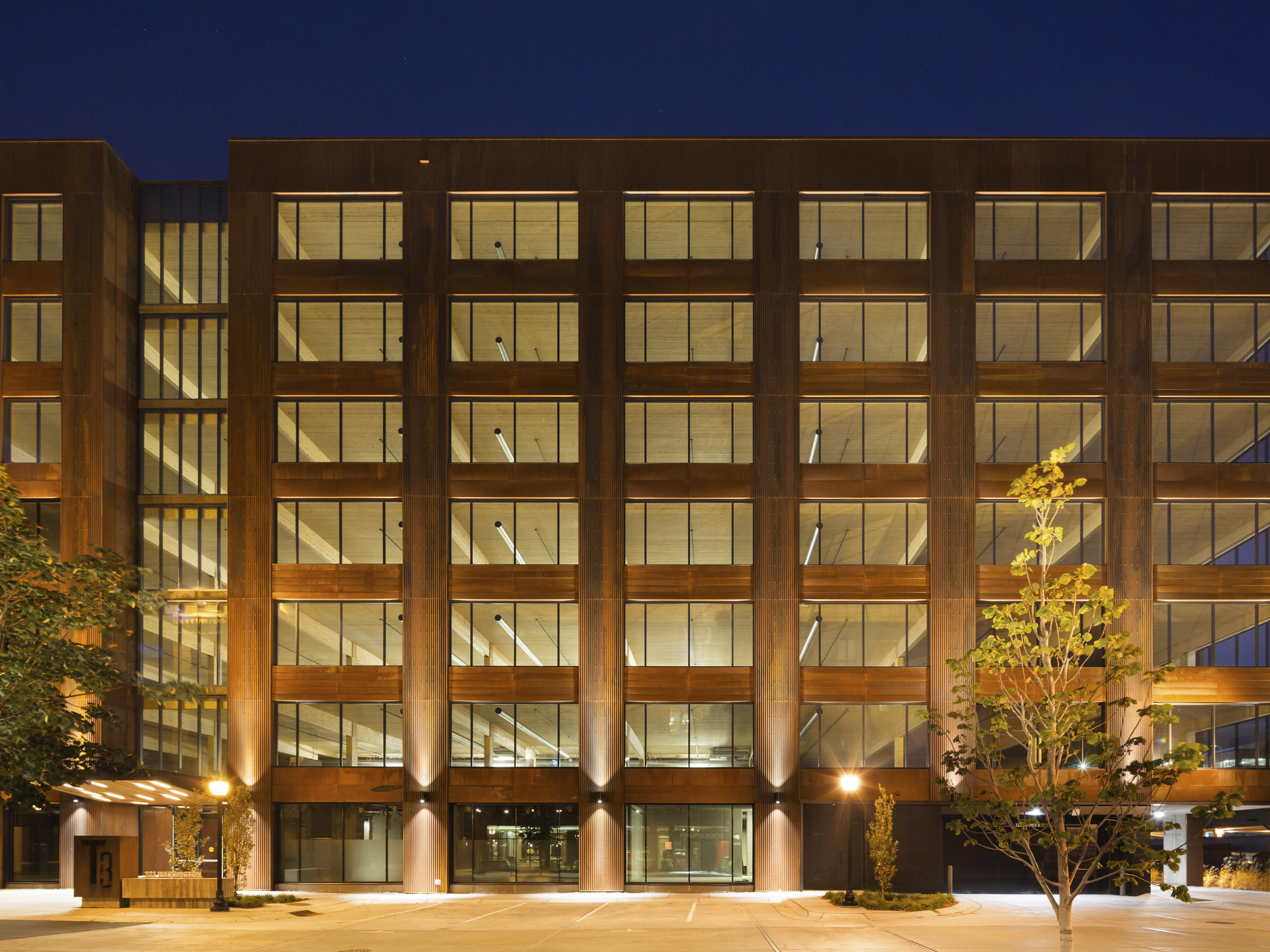 Hines T3 Partnership building in Minneapolis, a mass timber midrise building illuminated at night