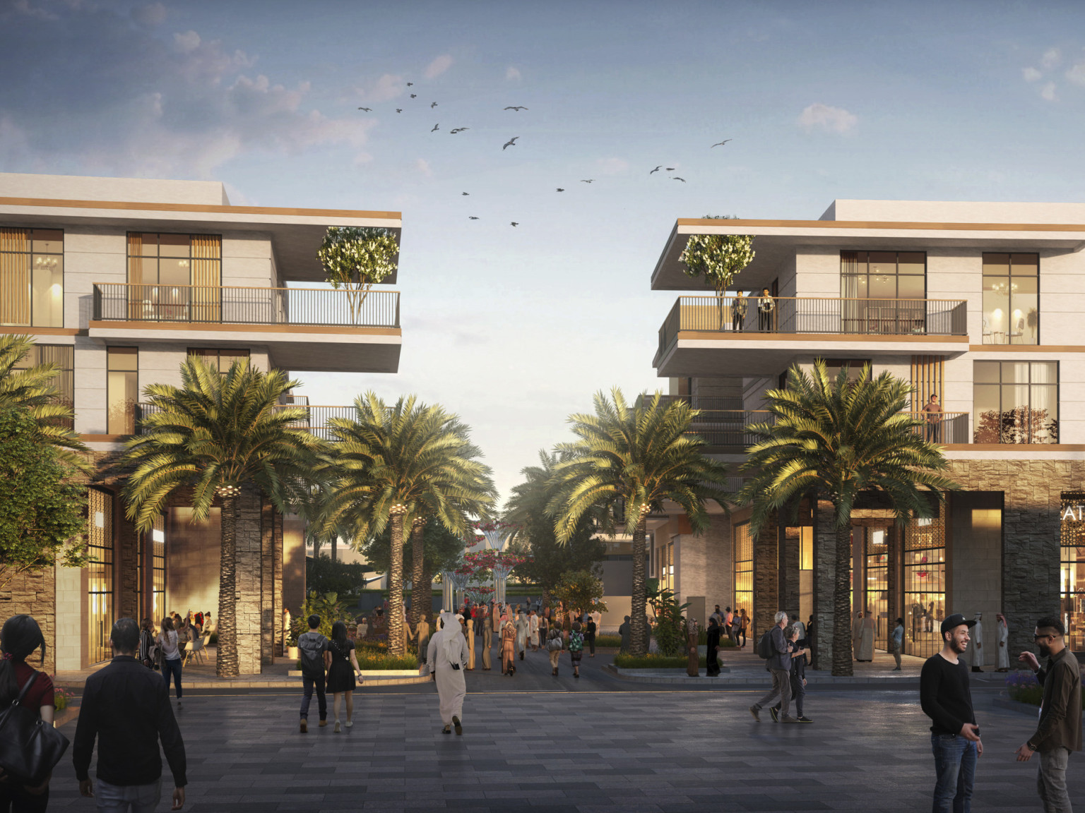 2 buildings with double height storefronts below 2 stories of living space with corner balconies over walkway with trees