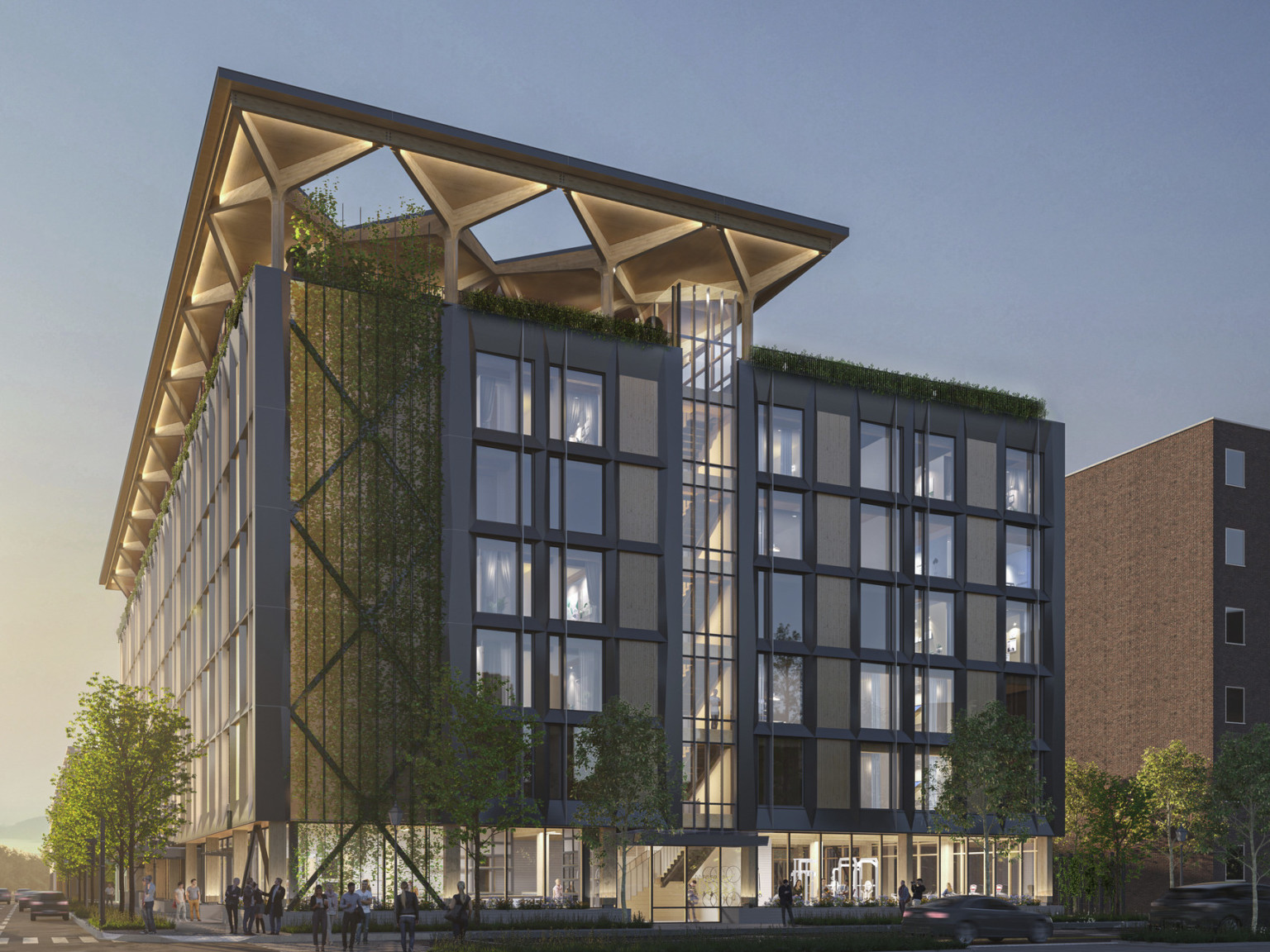 A mass timber midrise hotel with a blackened steel façade and timber infill with an arched timber canopy on a glassed-in rooftop