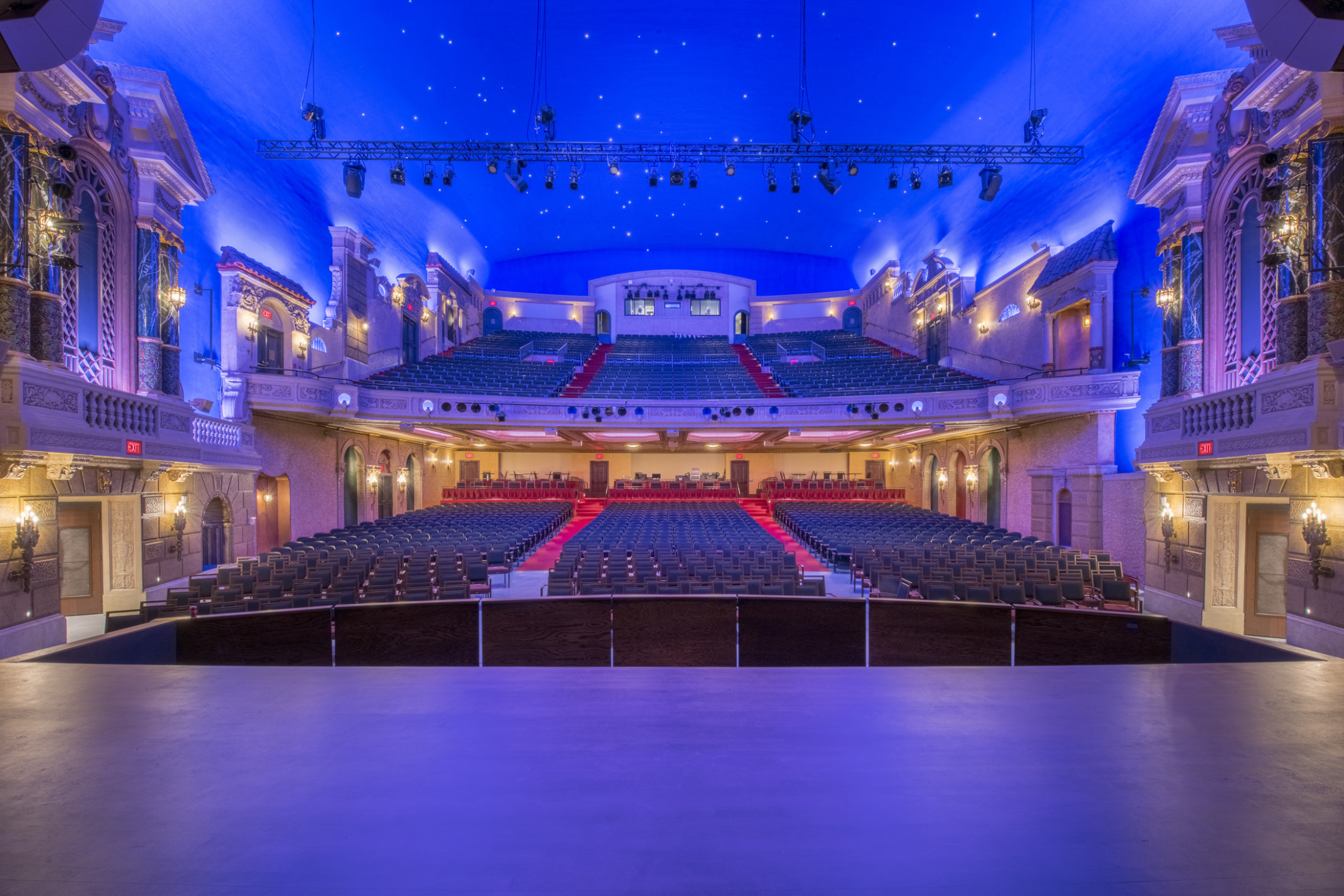 Capitol Theatre interior viewed from stage looking out to audience gallery and balcony. Faux facades along walls