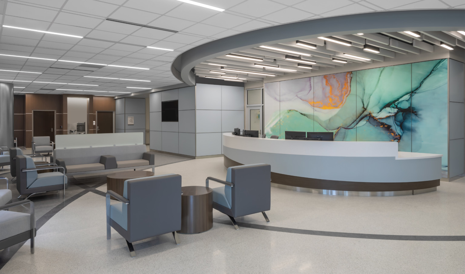 Waiting area lobby with long rounded reception desk in front of marbled wall mural in green with gold and purple accents