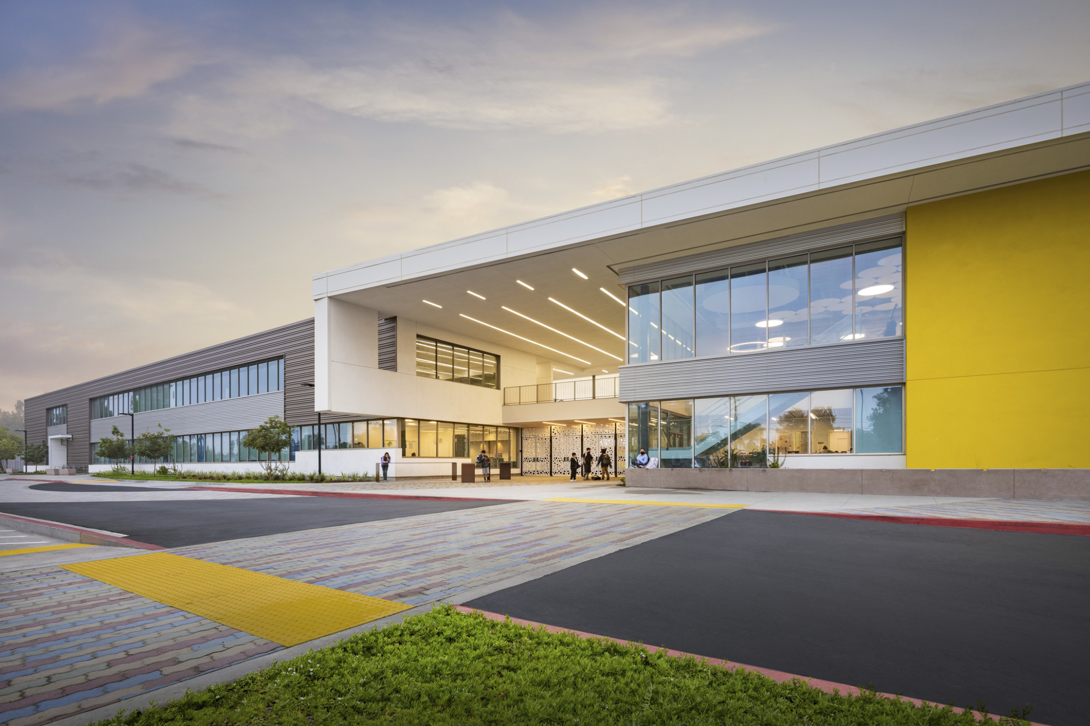 Exterior of Anaheim Elementary School District's Roosevelt Elementary School, a yellow accent wall with double height window