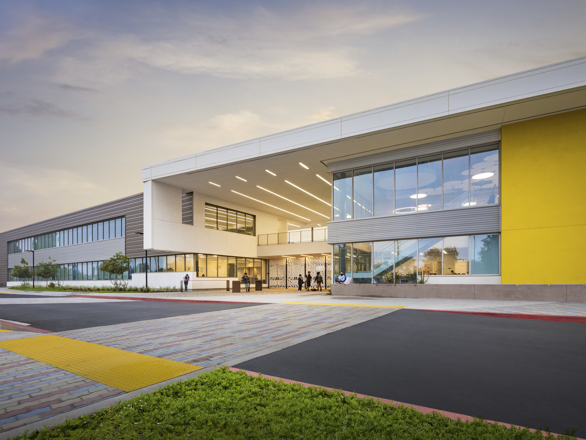 Exterior of Anaheim Elementary School District's Roosevelt Elementary School, a yellow accent wall with double height window