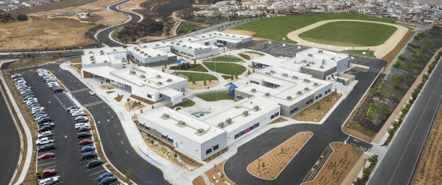 aerial view of campus with green grass snaking through