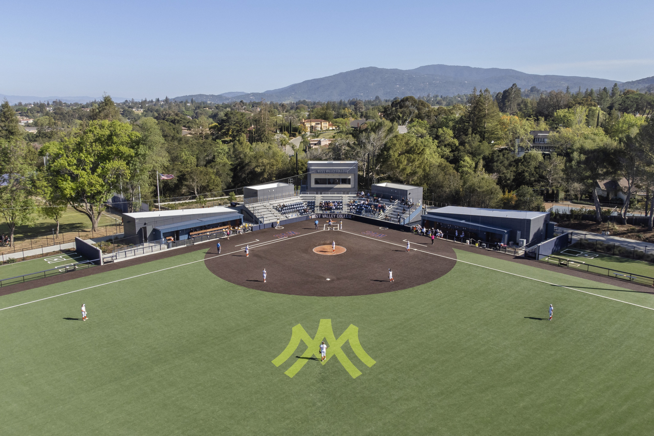 West Valley College Softball Field viewed from above looking towards home plate and bleachers. WV logo in center field