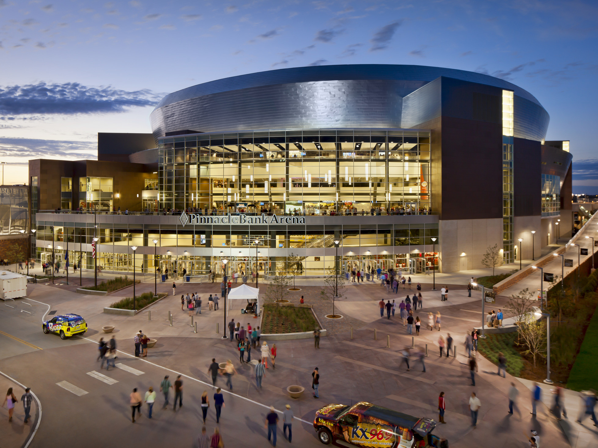 Exterior of Pinnacle Bank Arena in Lincoln Nebraska, a rounded multi story building with large windows and silver roof