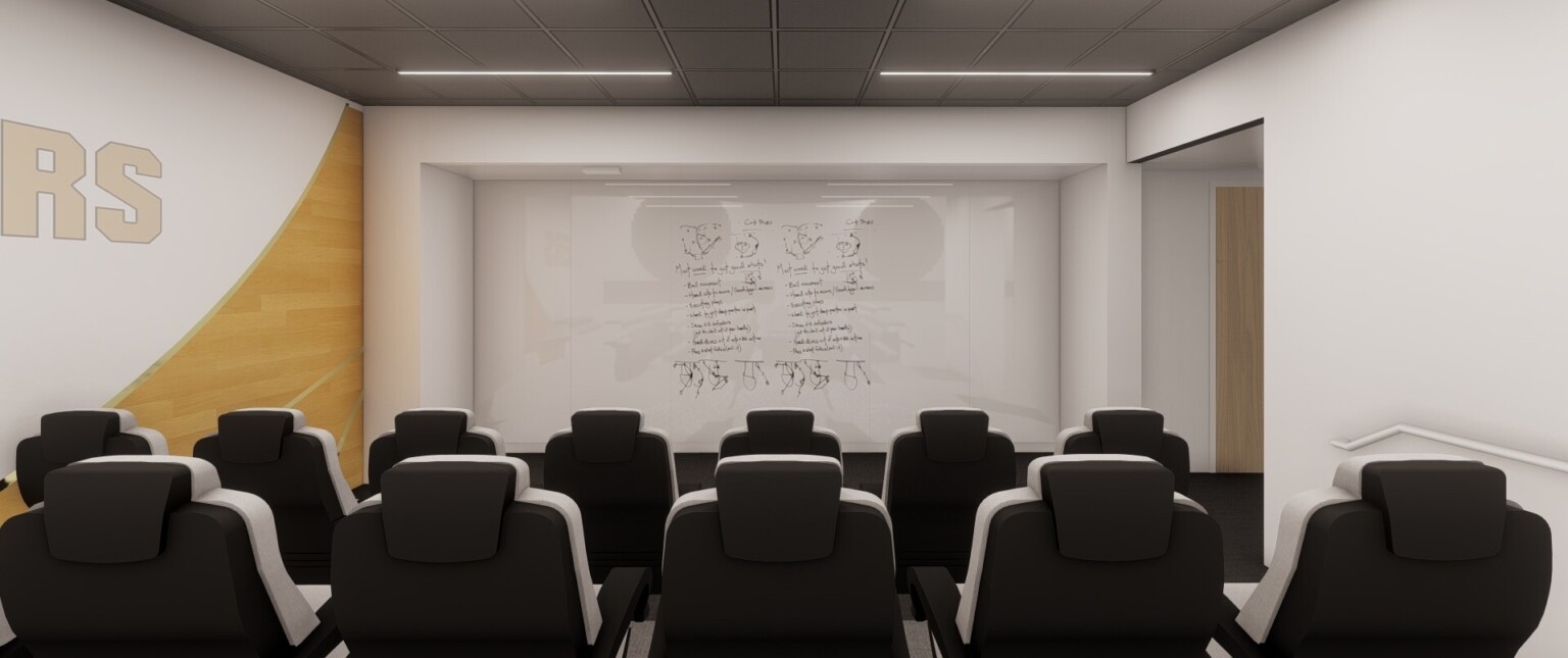 Small auditorium with comfortable grey stadium style seats looking to large screen. Wood and white mural on far wall with Boilermakers sign