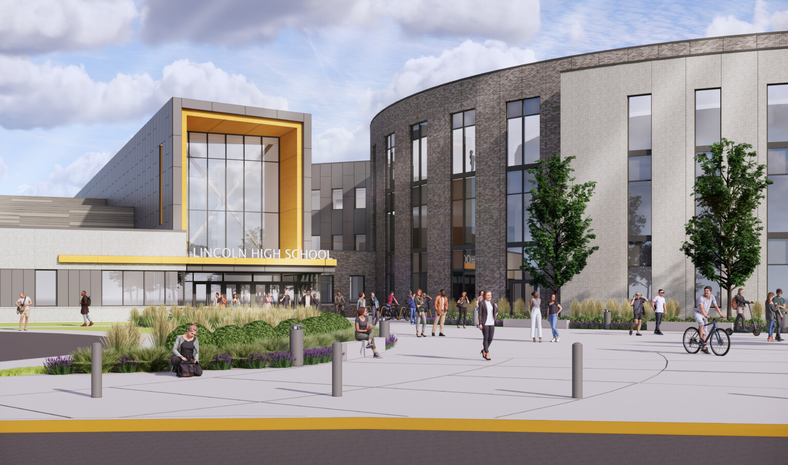 Front entrance to Lincoln High School. Landscaped sidewalk to 3 story building with covered entrance, round building to right