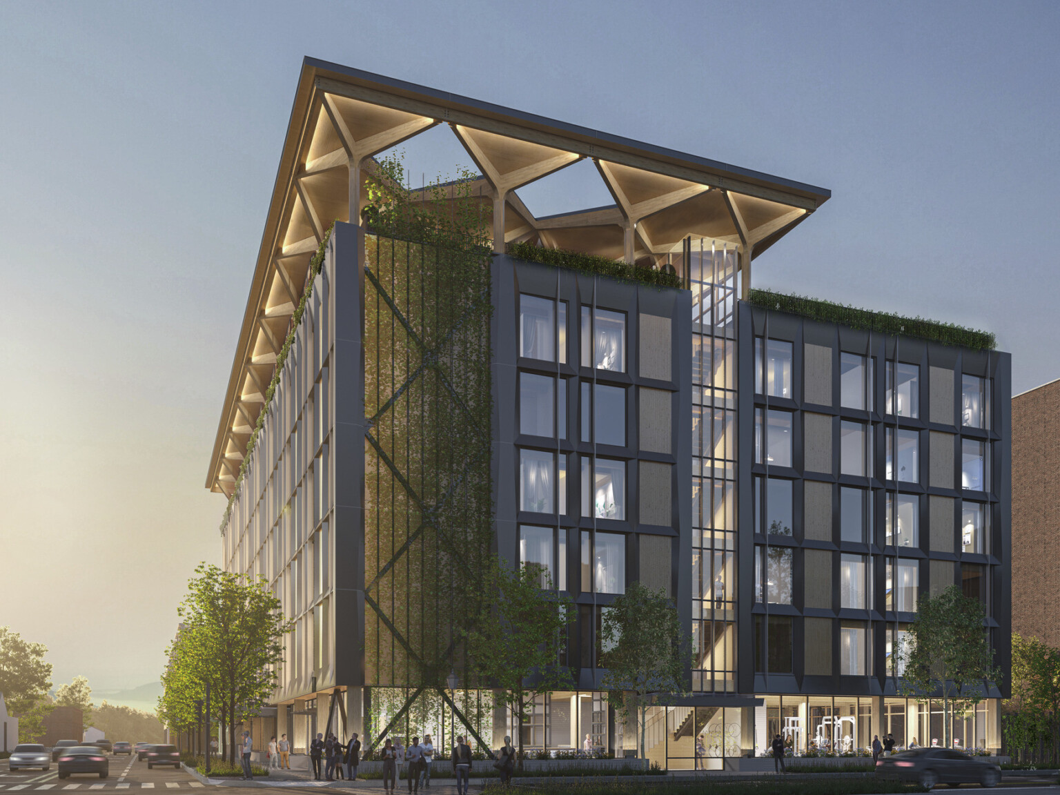 A midrise building with a blackened steel façade and timber infill with an arched timber canopy on a glassed-in rooftop