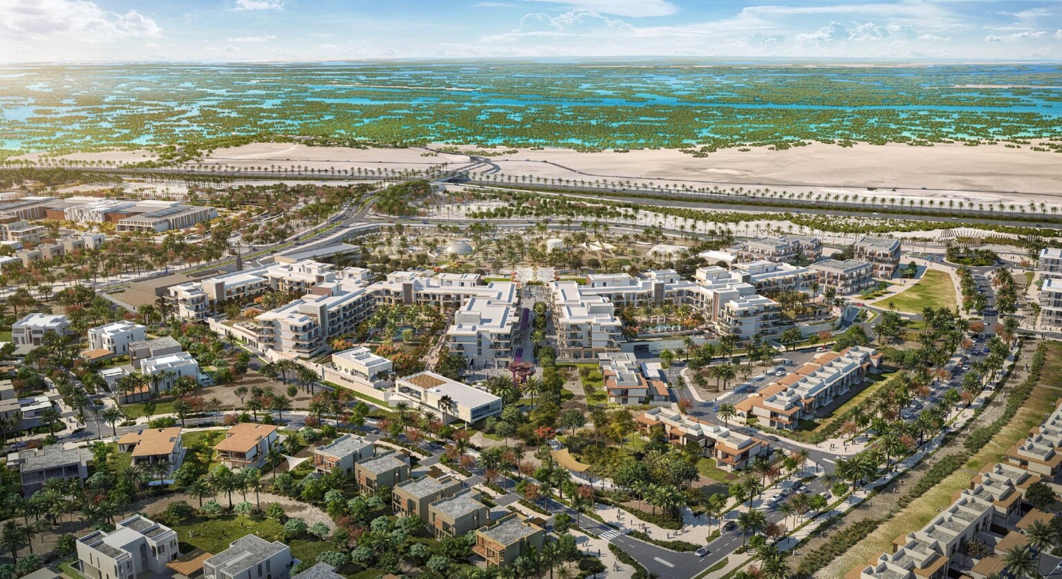 Aerial view of master plan, tall buildings curve along center line of mixed-use development with views of the Persian Gulf water