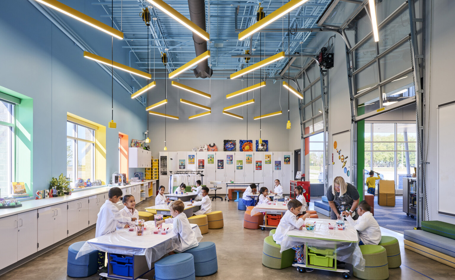 A colorful science lab is a hub of activity as kids work together to conduct experiments and discover new things. A colorful science lab is a hub of activity as kids work together to conduct experiments and discover new things.