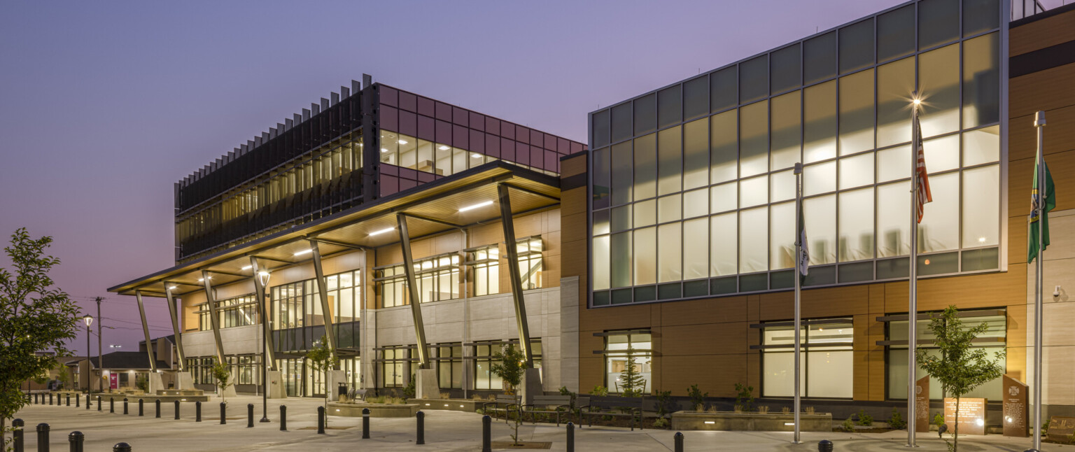 The main entrance in the four-story central tower of Marysville Civic Campus welcomes residents and visitors, sets a new architectural standard for the city and engages with an adjacent city park, main entrance in the four-story central tower, and employs floor-to-ceiling privacy windows on the upper level