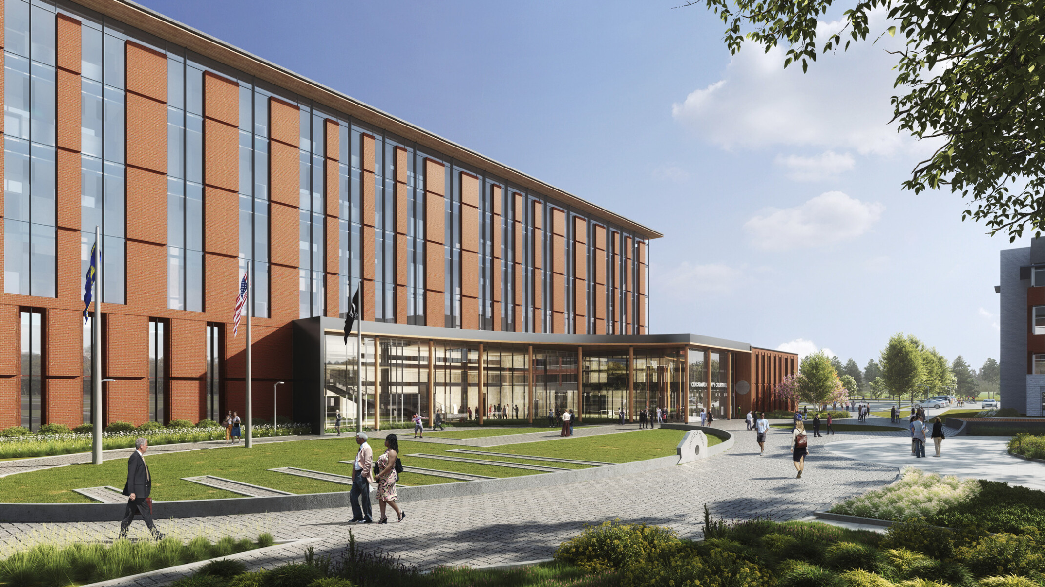 Design concept for Clackamas Courthouse, a large eight-story building in Oregon, red brick façade with vertical window panels create a striped fenestration, green lawn out front 