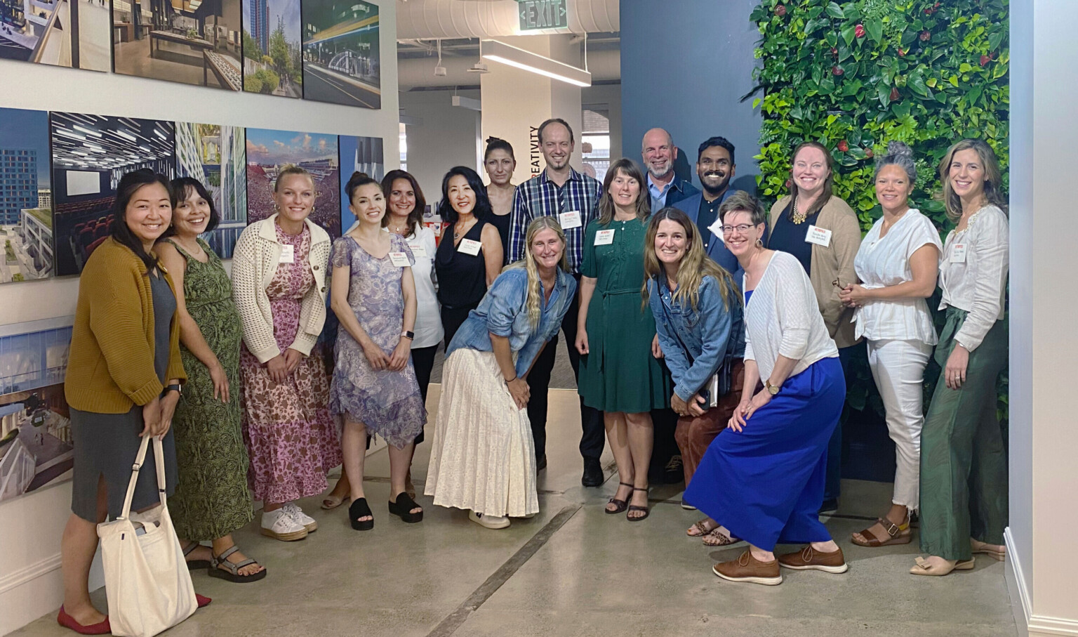 Metropolis Climate Toolkit for Interior Design San Fransisco workshop team in light-filled foyer with modern floor-to-ceiling windows.