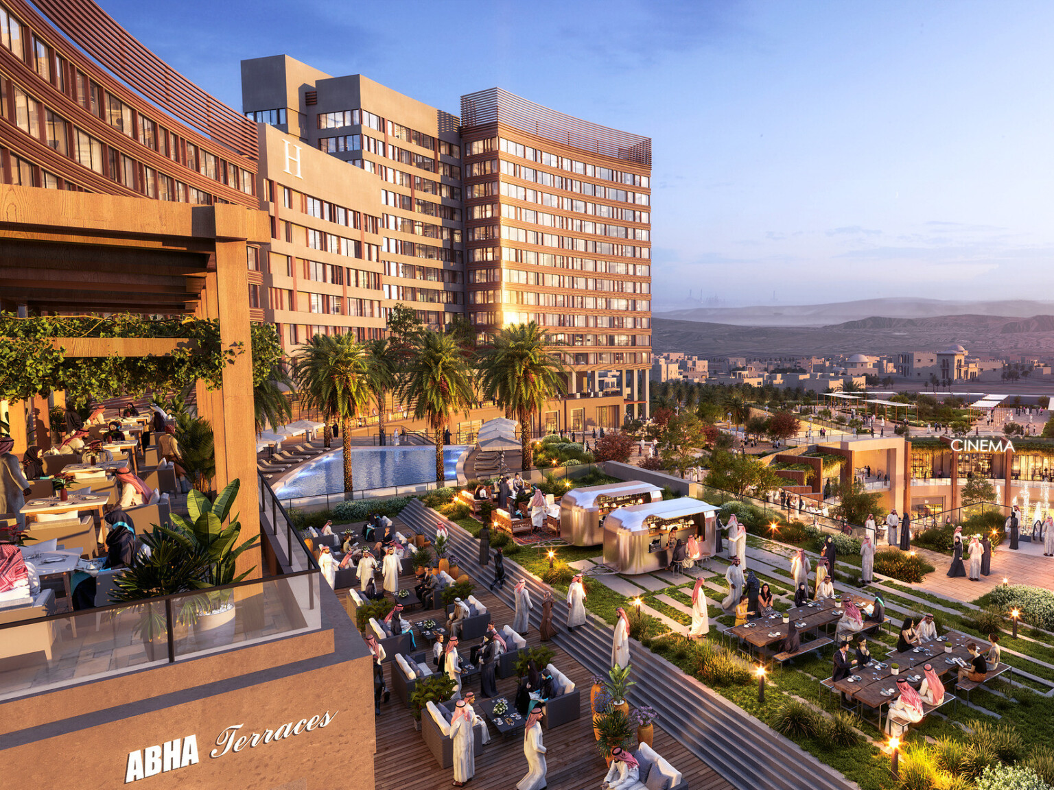 Upper level of outdoor shopping center looking down, seen in the evening. Multiple planters and green roofs by patio restaurant seating