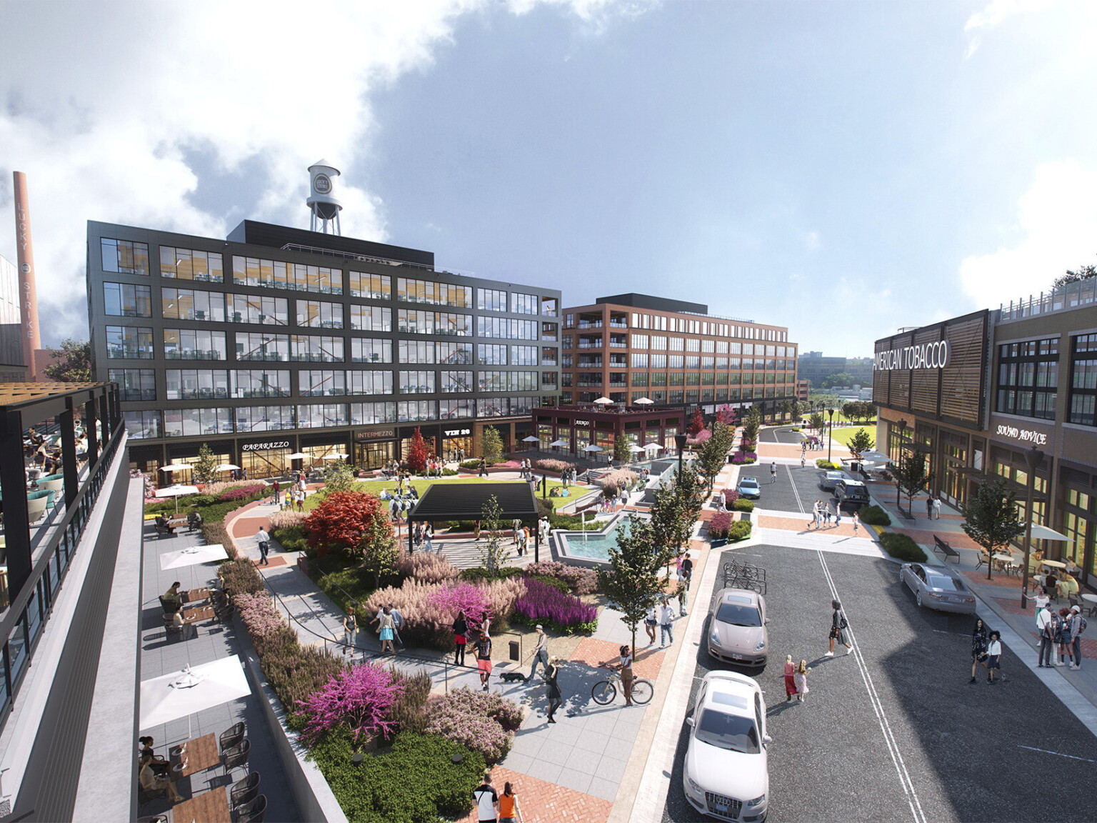 Elevated street view of dual mass timber office buildings with large windows and green space