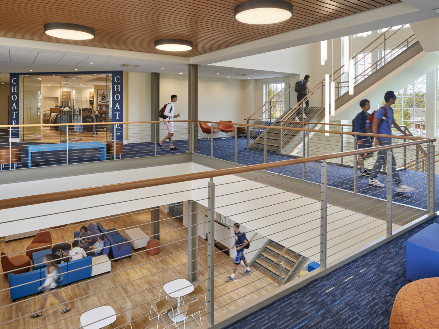 2nd floor mid level in triple height atrium, rail around volume looking to ground floor, Choate student store opposite by stairs