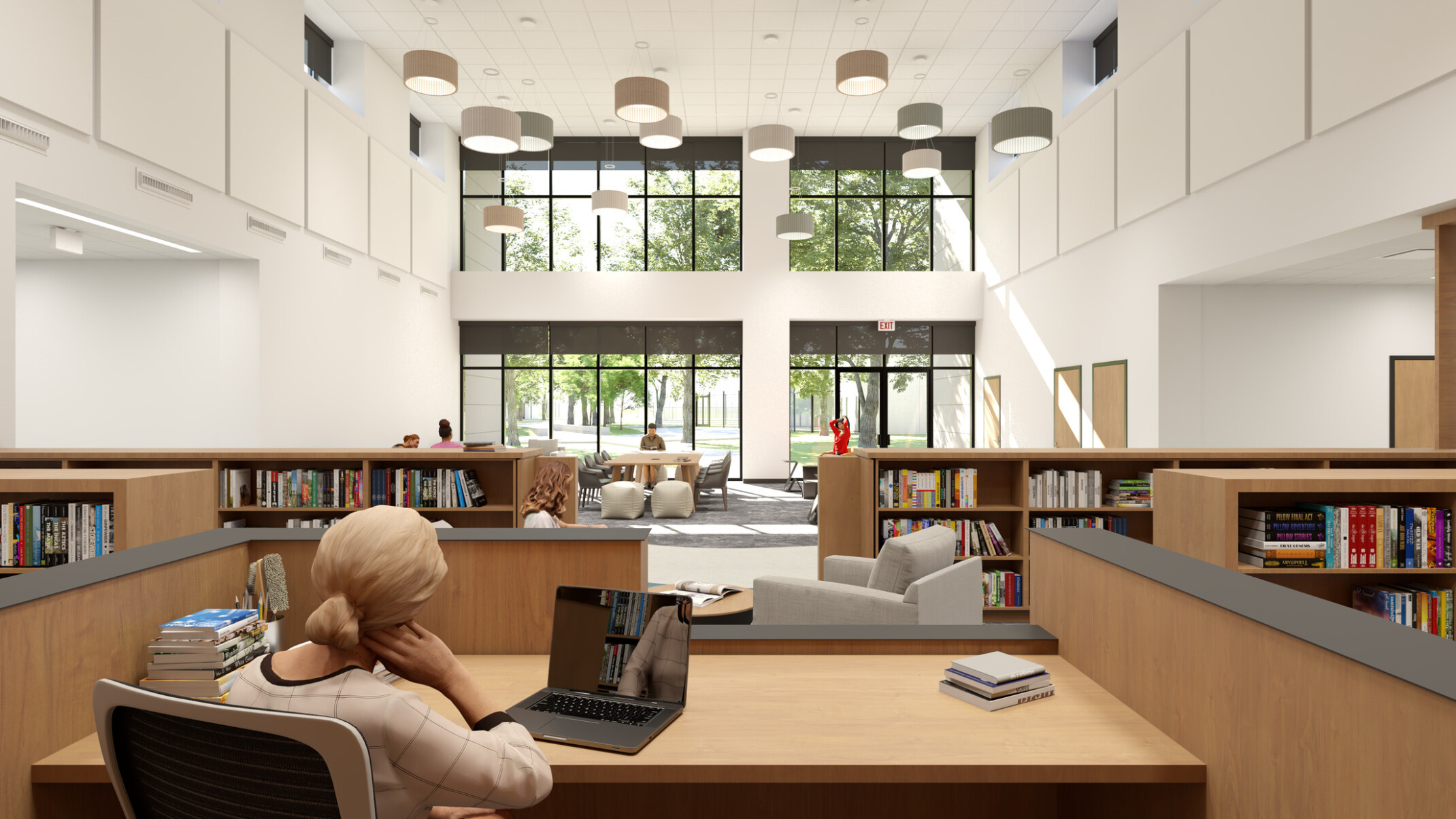 Rendering of woman working on laptop at a desk in a double-height library. Across the room, soft chairs are grouped in front of a window wall.