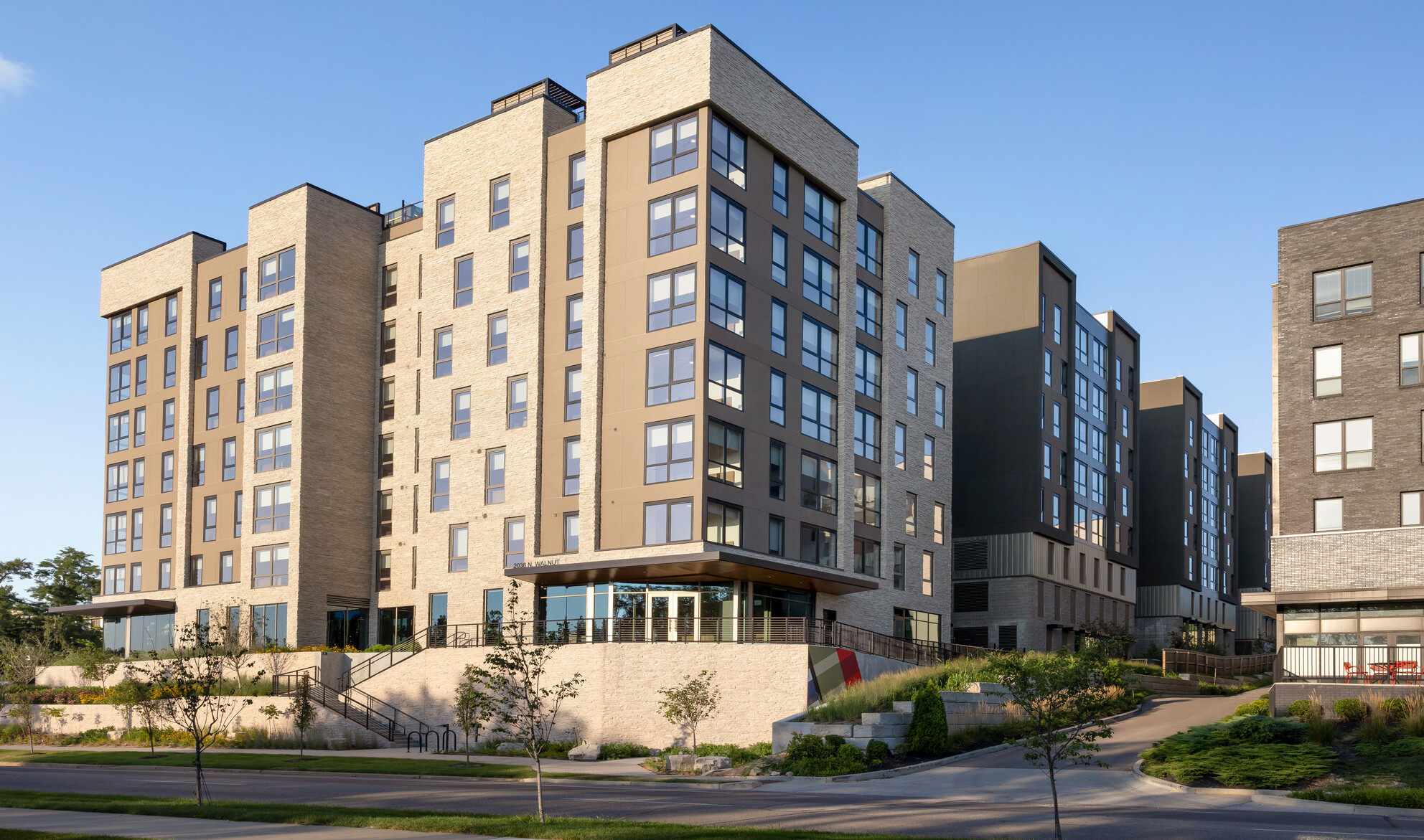 Hub Bloomington off campus student housing; Daytime view of stepped building facade facing the main street.