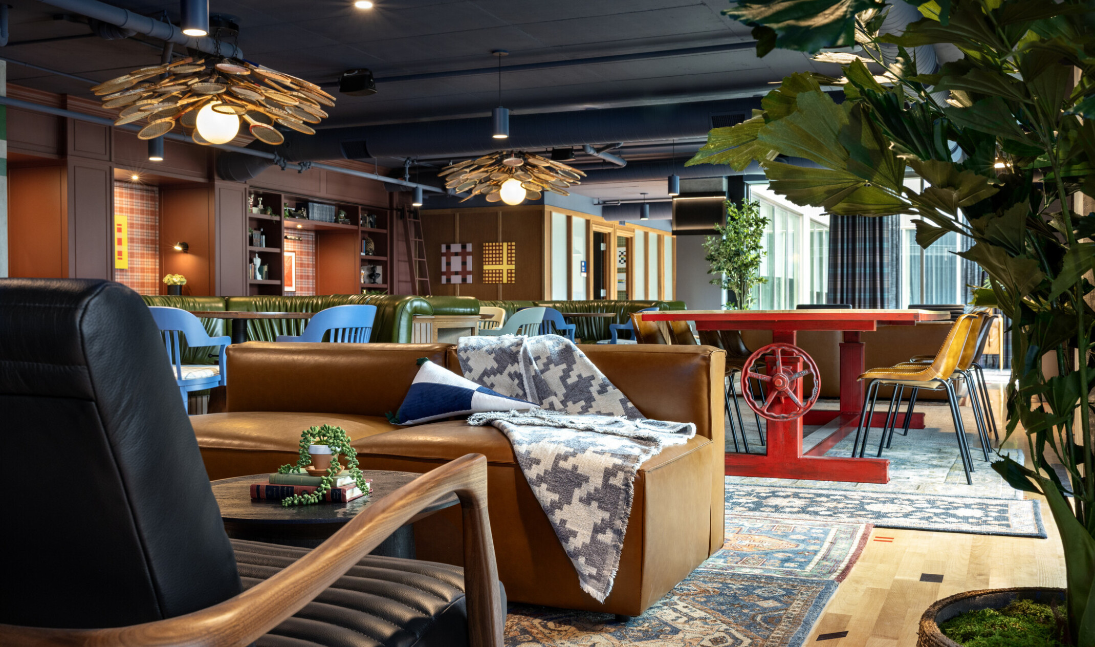 Hub Bloomington off campus student housing; Low-angle view of Academic Hub seating groups and crank-style feature table.